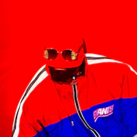 Artistic close-up image of Nevv Evve in immersive red lighting featuring experimental alternative pop visual aesthetics and fashion styling.